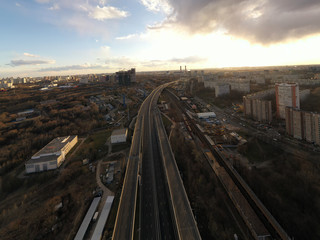 Fototapeta na wymiar panoramic views from the drone of the railway and the highway of the big city