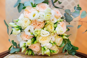 Elegant bouquet of roses on a chair. closeup of wedding bouquet.