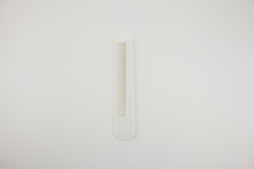 White hairbrush on a white background