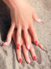 finger nails in the sand