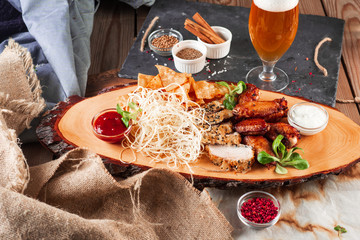 Chicken wings, cheese and breaded fish served with cold beer