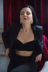 Fototapeta premium Photo of beautiful young woman in sexual fashion black clothes