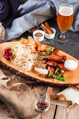 Chicken wings, cheese and breaded fish served with cold beer