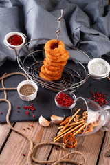 Fried breaded onion rings with beer sauce