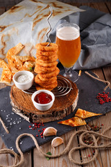 Fried breaded onion rings with beer sauce