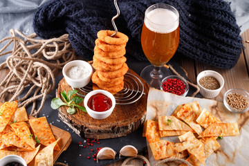 Fried breaded onion rings with beer sauce