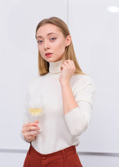 young woman with glass of wine