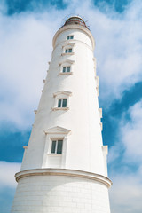 Lighthouse on a background of blue sky