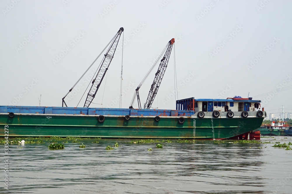 Wall mural ships on nha ben river in ho chi minh city