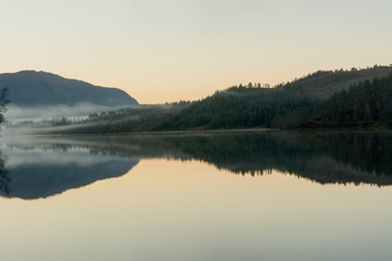 Fototapeta na wymiar Mountain, fog and lake 