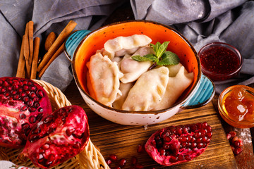 Close-up of fresh cooked dumplings with sauce