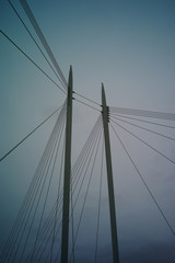 cable bridge over blue sky