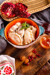 Close-up of fresh cooked dumplings with sauce
