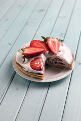Pancake pie with strawberries. Dessert with cream and berries. National cuisine. Sweet pastries on...