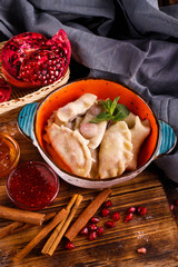 Close-up of fresh cooked dumplings with sauce