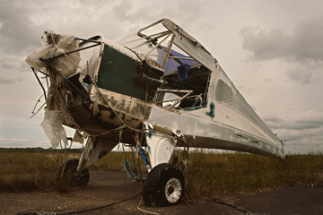 Vintage airplane fuselage remains on old airfield