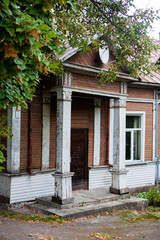 Porch with columns of an old wintage wooden house