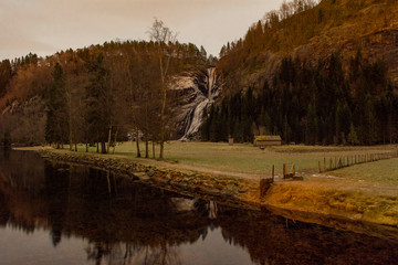 autumn landscape with lake and waterfall 