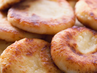 Pile of cottage cheese pancakes. Cottage cheese pancakes cheesecakes as a background.