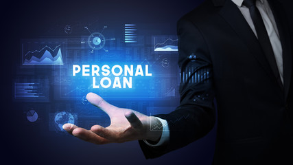 Hand of Businessman holding PERSONAL LOAN inscription, business success concept