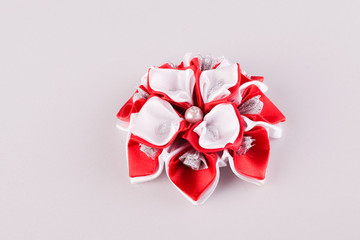 white and red hair brooch