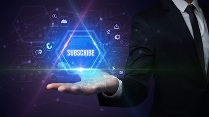 Man hand holding SUBSCRIBE inscription, social media concept