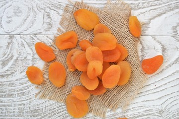 dried apricots on a wooden background