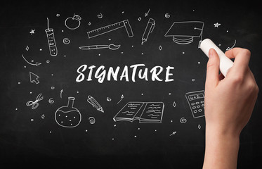 Hand drawing SIGNATURE inscription with white chalk on blackboard, education concept