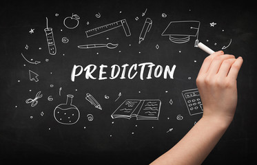 Hand drawing PREDICTION inscription with white chalk on blackboard, education concept