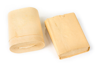 Old yellow toilet paper rolls  on a white