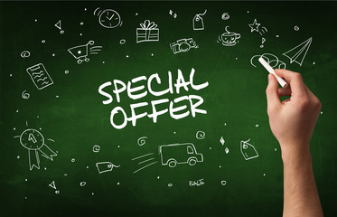 Hand drawing SPECIAL OFFER inscription with white chalk on blackboard, online shopping concept