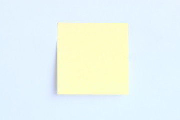 yellow post it on blue background