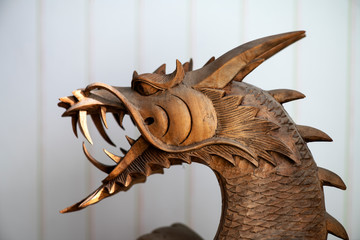 wooden oriental dragon with open mouth