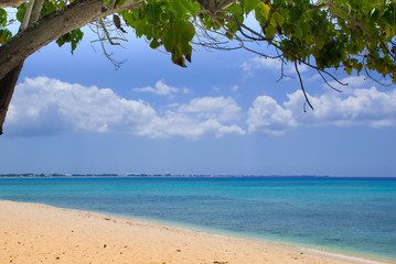 A section of Seven Mile Beach on Grand Cayman in the Cayman Islands. This tropical Caribbean island paradise is a hot spot for affluent tourism 