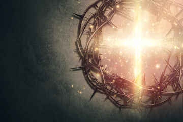 Crown of  thorns with glowing cross - 335651838