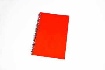 Red color covered single note paper diary isolated on a white background