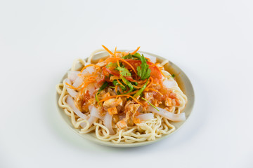 Delicious asian food in take-out box. Close up on noodles with fried vegetables and seafood then stirred soy sauce. Food delivery service.