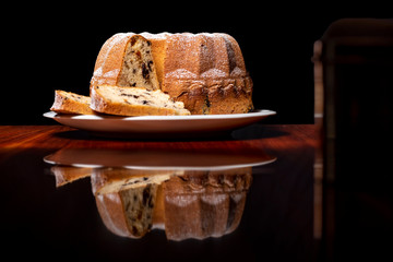 Cake, raisins, black background 03
