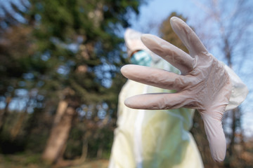 woman show stop, hand in focus indoors