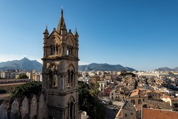 Fototapeta na wymiar The bell tower of the Palermo Cathedral with the city below