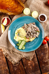 meat goulash is served with mashed potatoes and vegetables