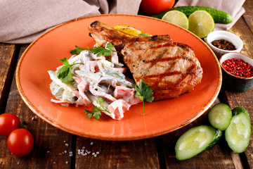 Roast pork loin served with vegetables in sauce