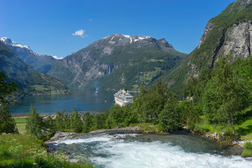 Fototapeta na wymiar Cruise ship in Geiranger fjord in Norway