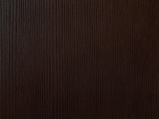 Plastic imitation of dark brown wood texture.