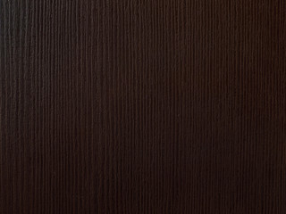 Plastic imitation of dark brown wood texture.