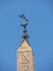 The dove with an olive branch on top of the obelisk, set on the Piazza Navona in Central Rome. Italy, Rome, August, 2012