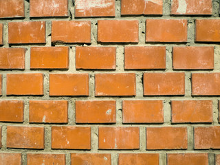 Obraz premium Red brick masonry in poke rows, background.