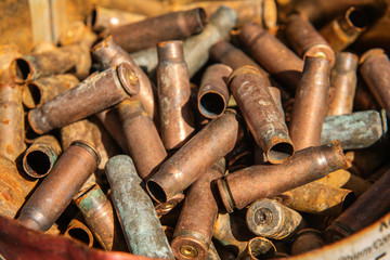 filled frame rusty used gun bullets  Empty brass shells