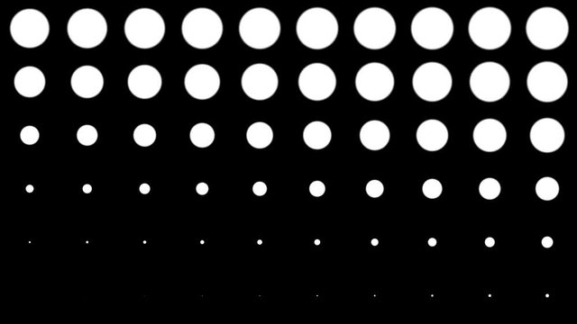 Seamless halftone white dots appear and disappear in motion at black background. Vintage pattern animation.
