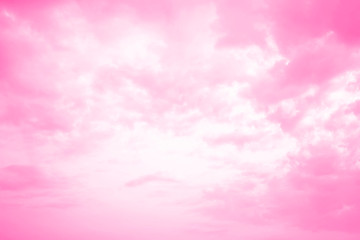Bright pink sky with fluffy marshmallow clouds